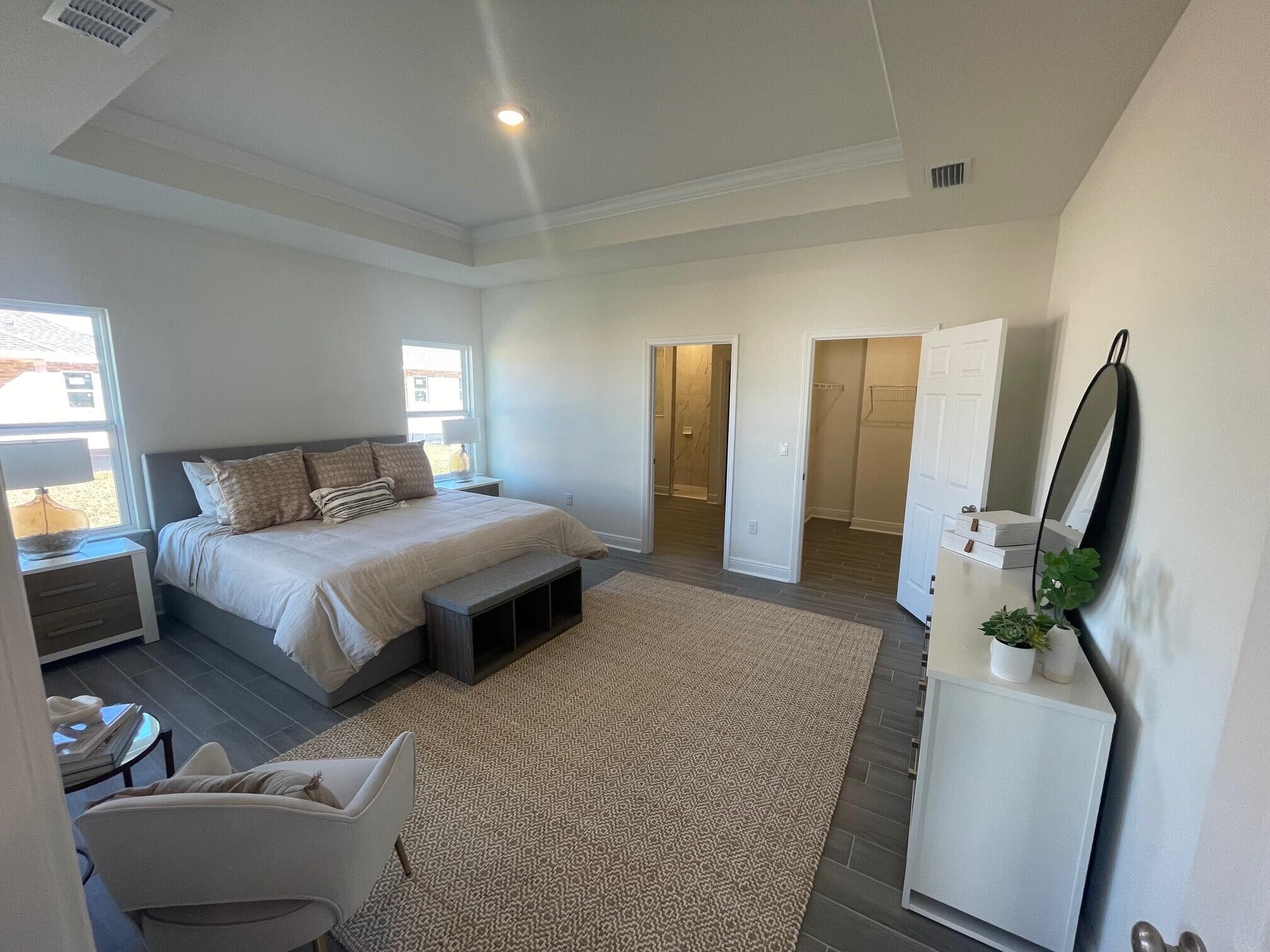 55 Splendor Run Ponce de Leon, FL 32455 - Photo 3 of 4 a bedroom with a bed mirror and window