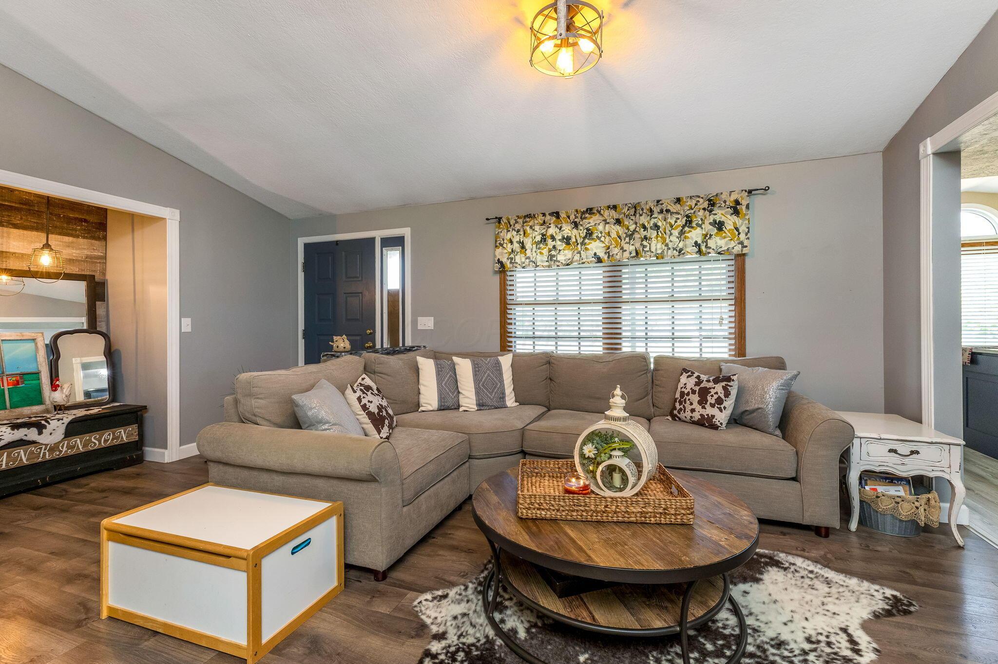 6651 Lancaster Road Hebron, OH 43025 - Photo 13 of 88 This incredible great room offers two distinct seating areas—a cozy spot to gather around the fireplace, and a more spacious section that easily accommodates additional seating for entertaining or relaxing in comfort.This incredible great room offers two distinct seating areas—a cozy spot to gather around the fireplace, and a more spacious section that easily accommodates additional seating for entertaining or relaxing in comfort.