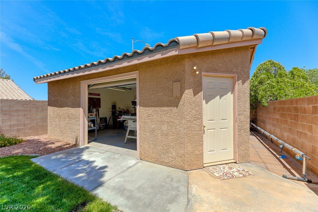 2001 Appaloosa Road Henderson, NV 89002 - Photo 7 of 44 This versatile structure offers additional storage and a functional workspace.