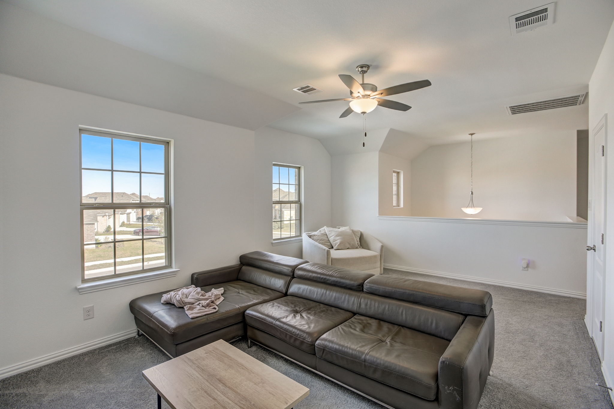 308 Monteforte Road Hutto, TX 78634 - Photo 27 of 32 a living room with furniture ceiling fan and a window
