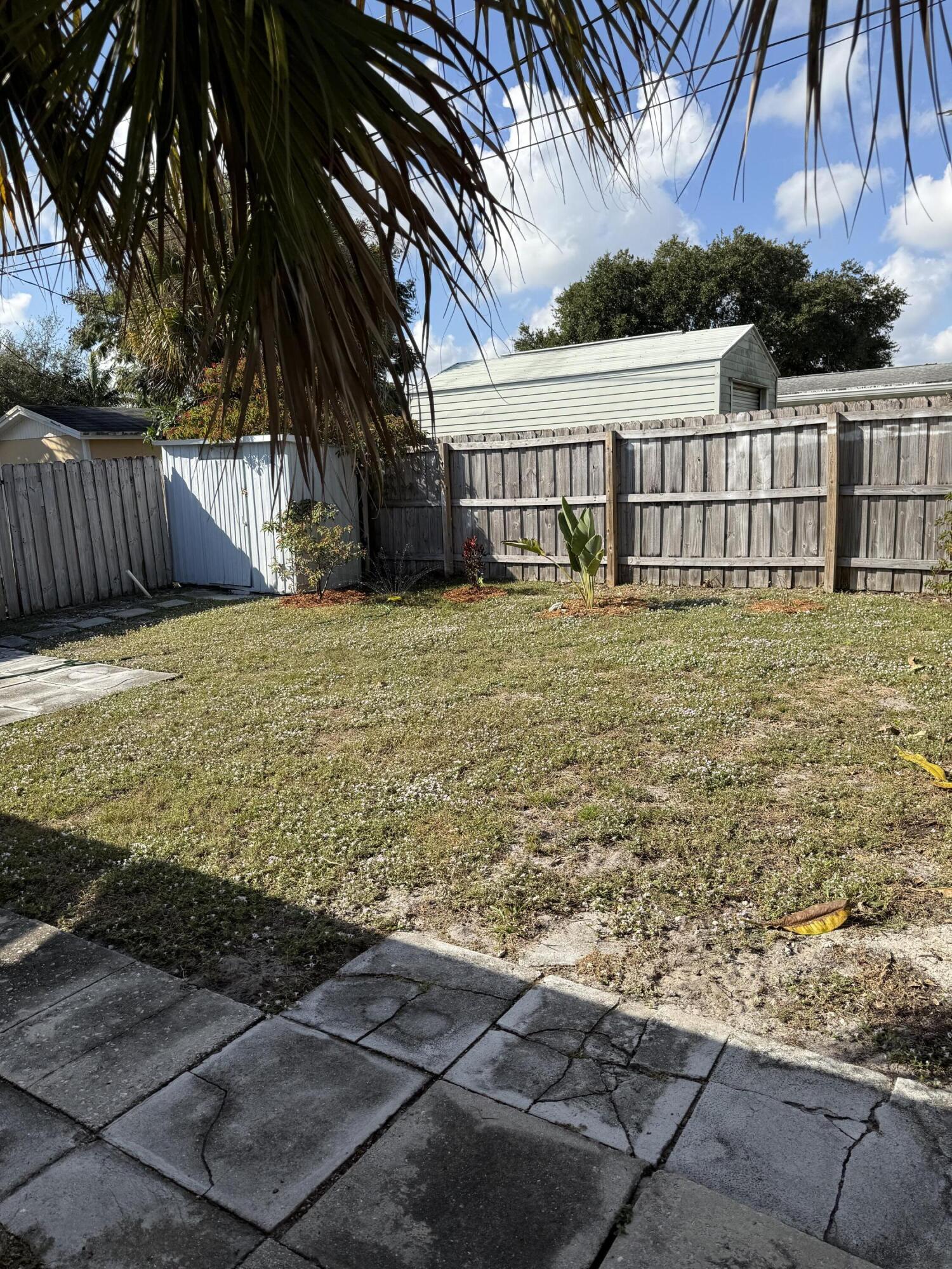 440 Southeast Fini Drive Stuart, FL 34996 - Photo 17 of 17 a view of a yard with wooden fence