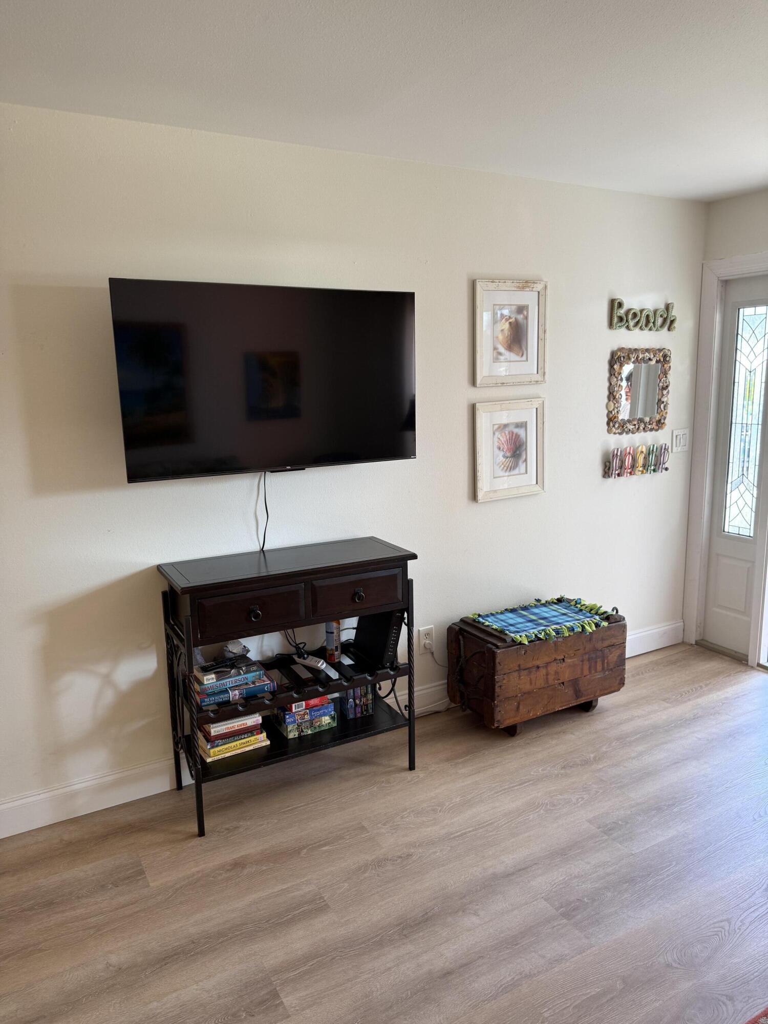 440 Southeast Fini Drive Stuart, FL 34996 - Photo 4 of 17 a living room with furniture and a flat screen tv