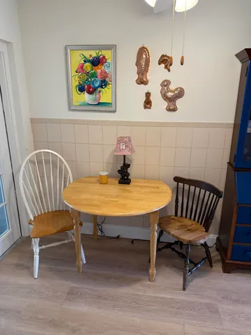 a view of a room with furniture and wooden floor