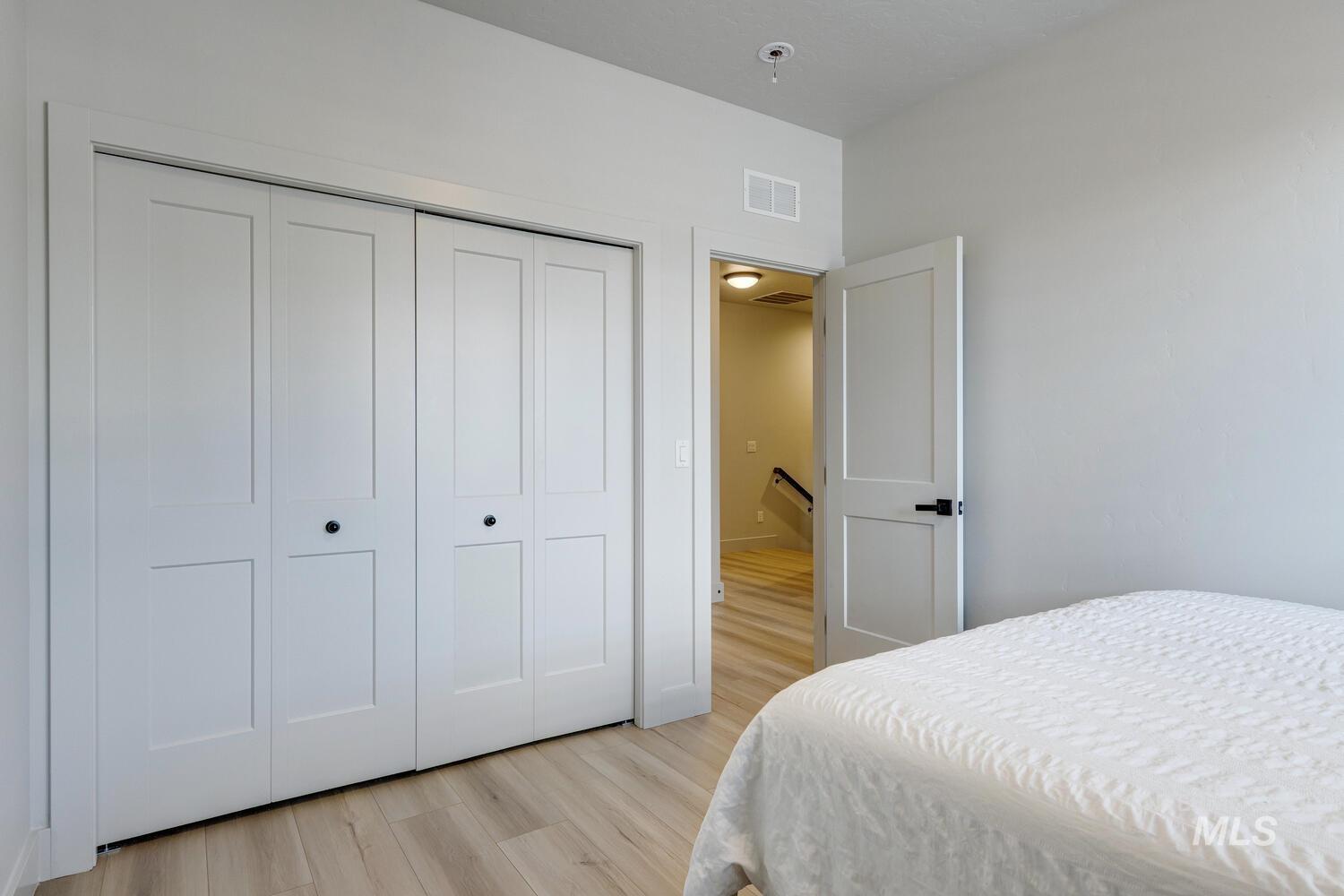 3255 South Millbrook Way Boise, ID 83716 - Photo 30 of 37 Bedroom with light wood finished floors and a closet