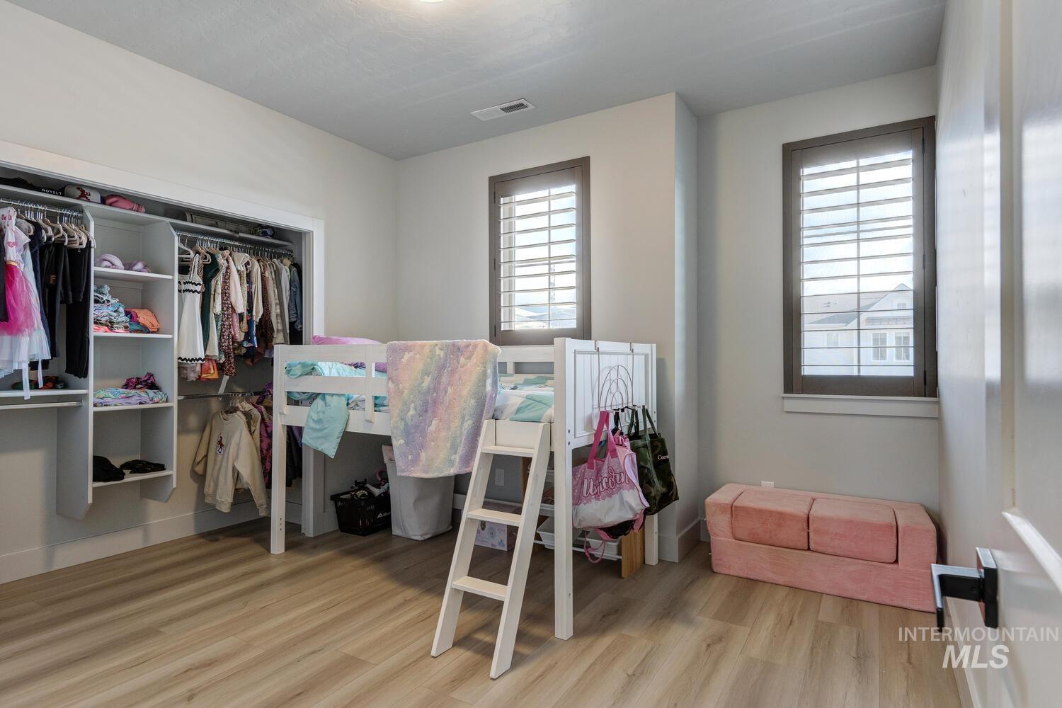 3255 South Millbrook Way Boise, ID 83716 - Photo 32 of 37 Bedroom with a closet and light wood finished floors