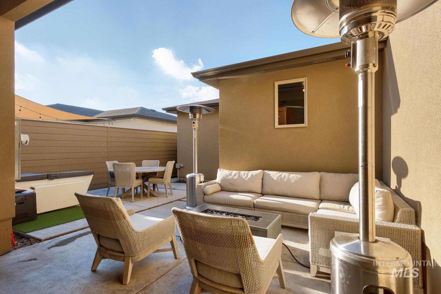 3255 South Millbrook Way Boise, ID 83716 - Photo 33 of 37 View of patio with outdoor dining space, a jacuzzi, and outdoor lounge area