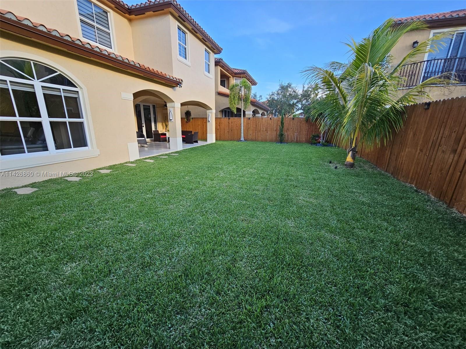 3166 Southwest 155th Avenue Miami, FL 33185 - Photo 17 of 27 a view of house with backyard