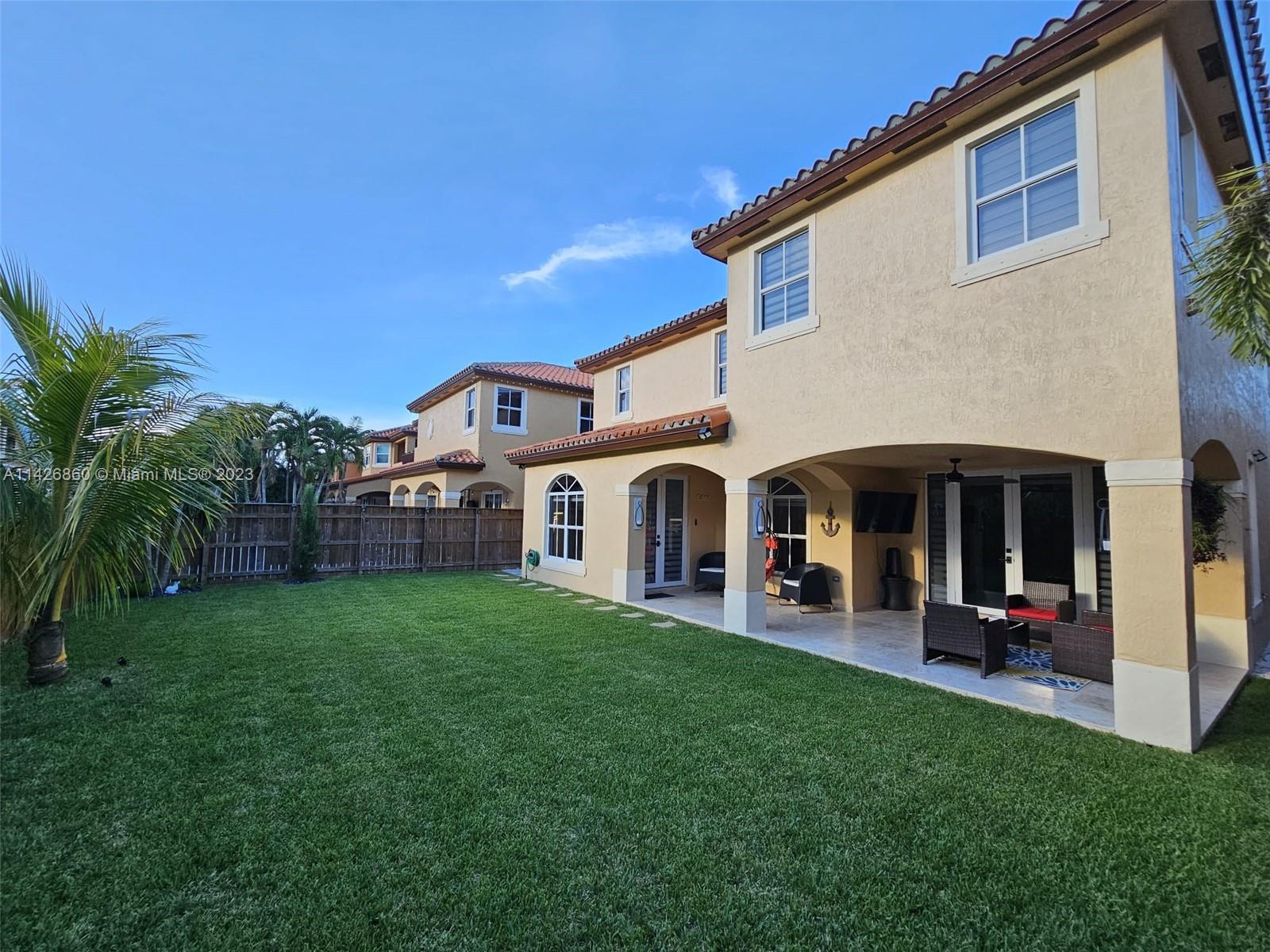 3166 Southwest 155th Avenue Miami, FL 33185 - Photo 18 of 27 a view of a house with a yard and sitting area