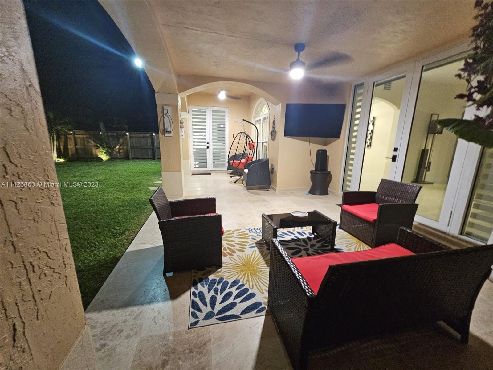 3166 Southwest 155th Avenue Miami, FL 33185 - Photo 20 of 27 a living room with furniture and a wooden floor
