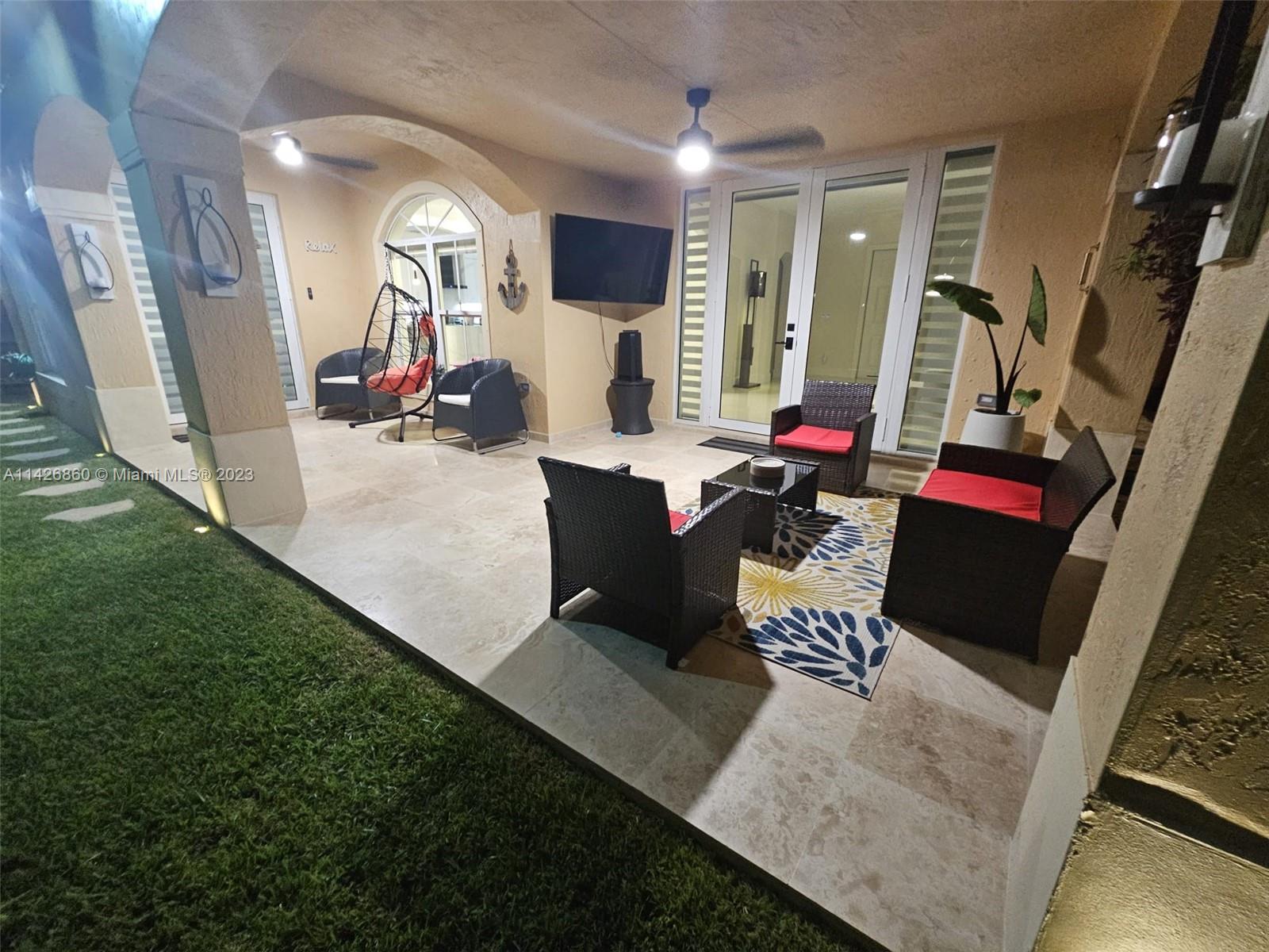 3166 Southwest 155th Avenue Miami, FL 33185 - Photo 21 of 27 a living room with dining room and wooden floor