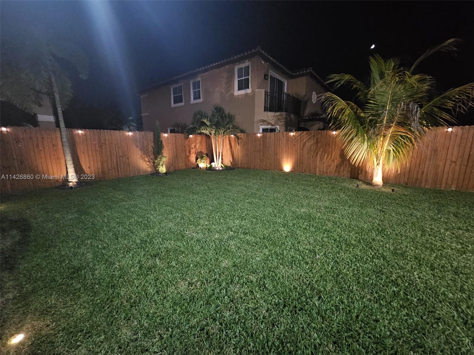 3166 Southwest 155th Avenue Miami, FL 33185 - Photo 23 of 27 a front view of a house with a yard