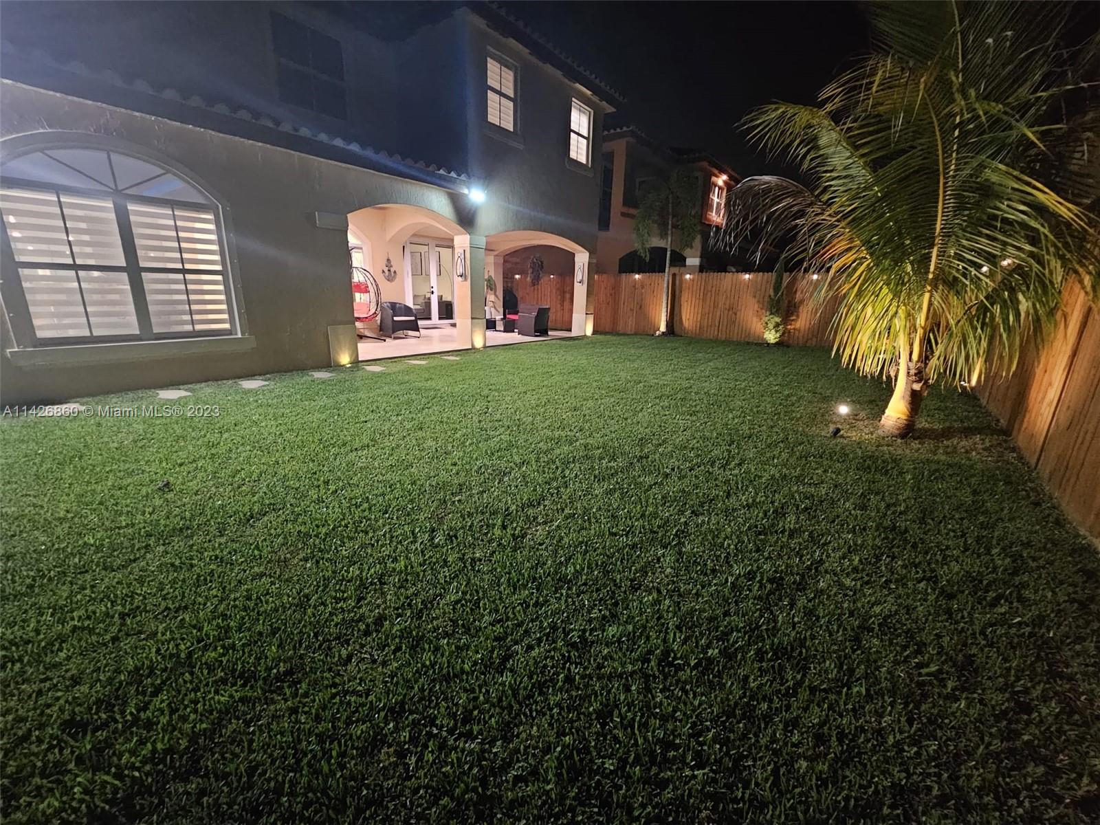 3166 Southwest 155th Avenue Miami, FL 33185 - Photo 25 of 27 a front view of house with yard and green space