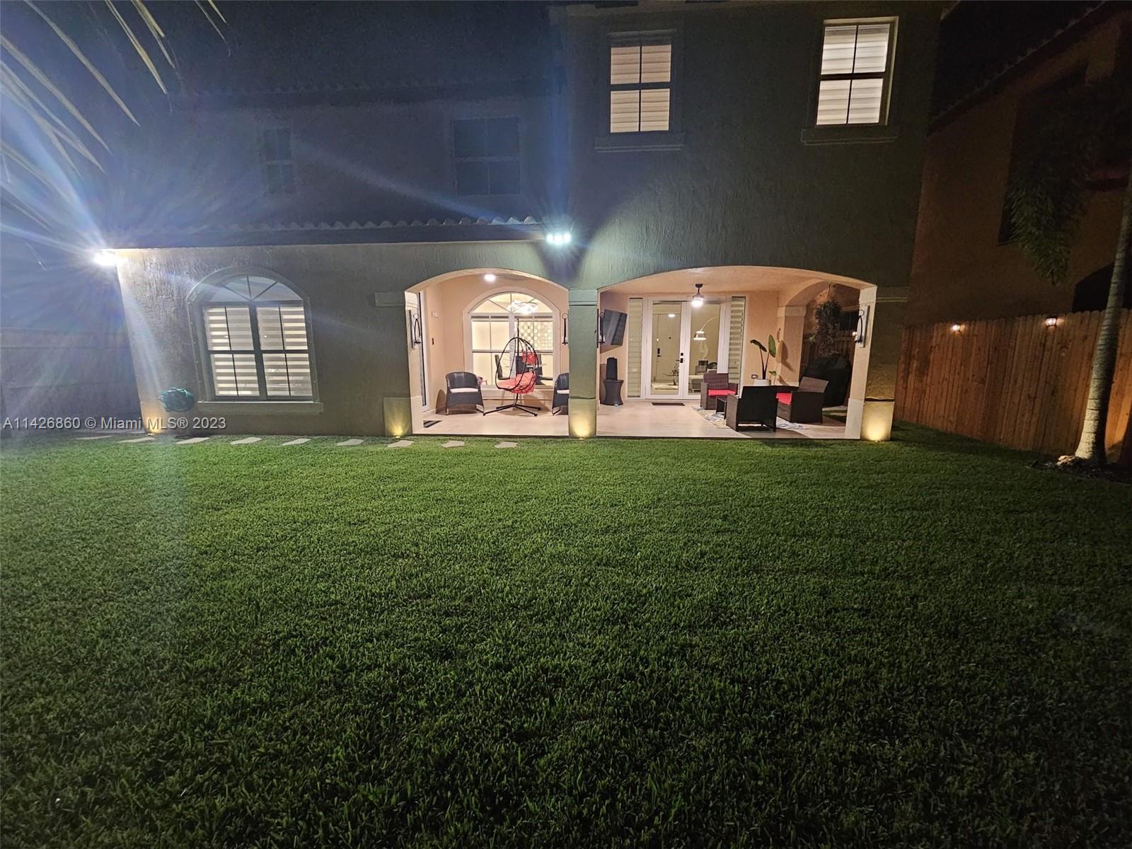 3166 Southwest 155th Avenue Miami, FL 33185 - Photo 26 of 27 a view of a house with backyard and sitting area