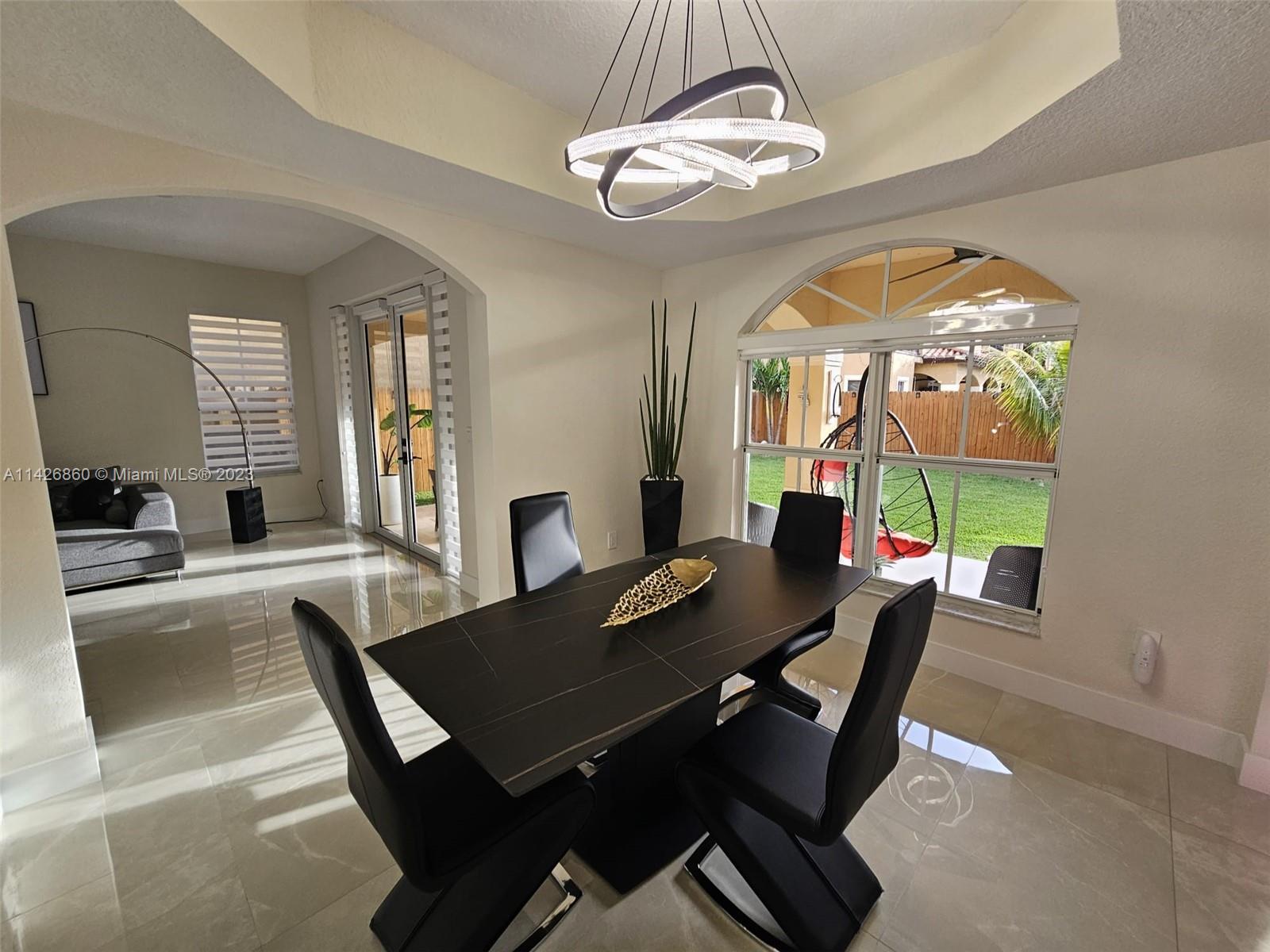 3166 Southwest 155th Avenue Miami, FL 33185 - Photo 5 of 27 a view of a dining room with furniture window and wooden floor