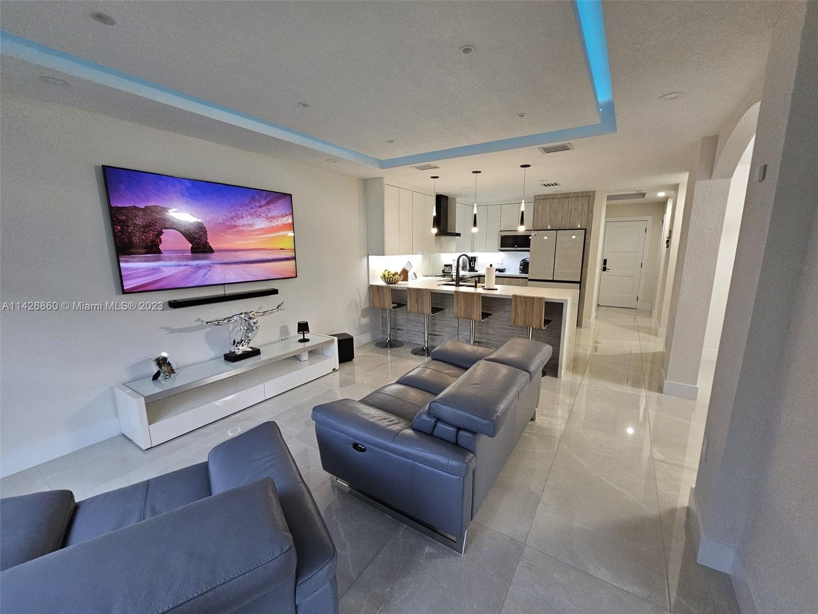 3166 Southwest 155th Avenue Miami, FL 33185 - Photo 10 of 27 a living room with furniture and a flat screen tv