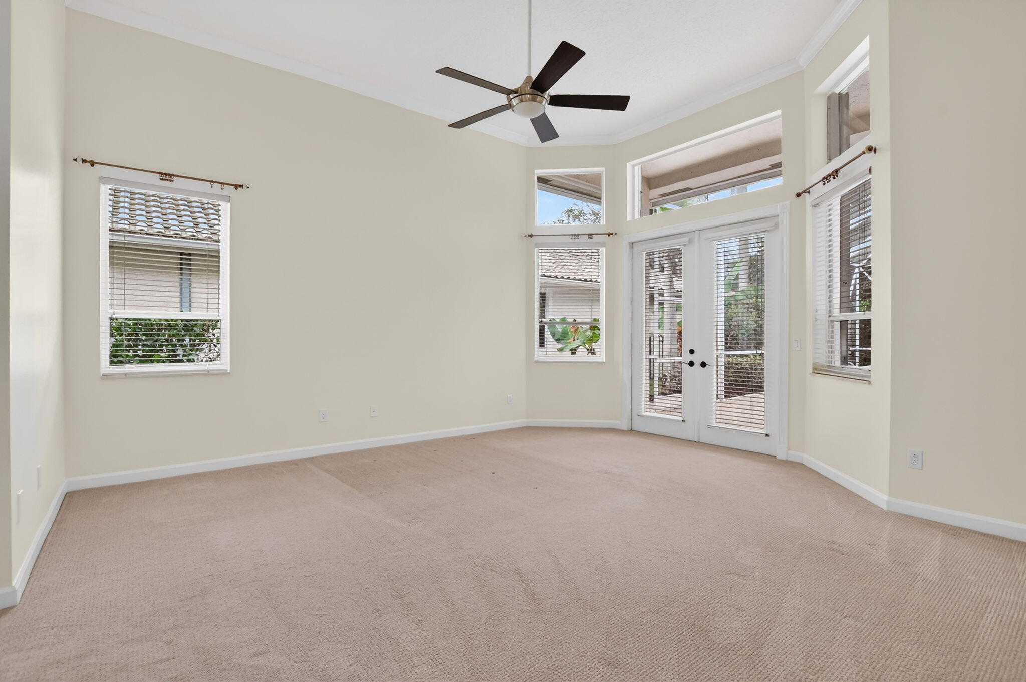 21719 Marigot Drive Boca Raton, FL 33428 - Photo 14 of 53 an empty room with windows and fan
