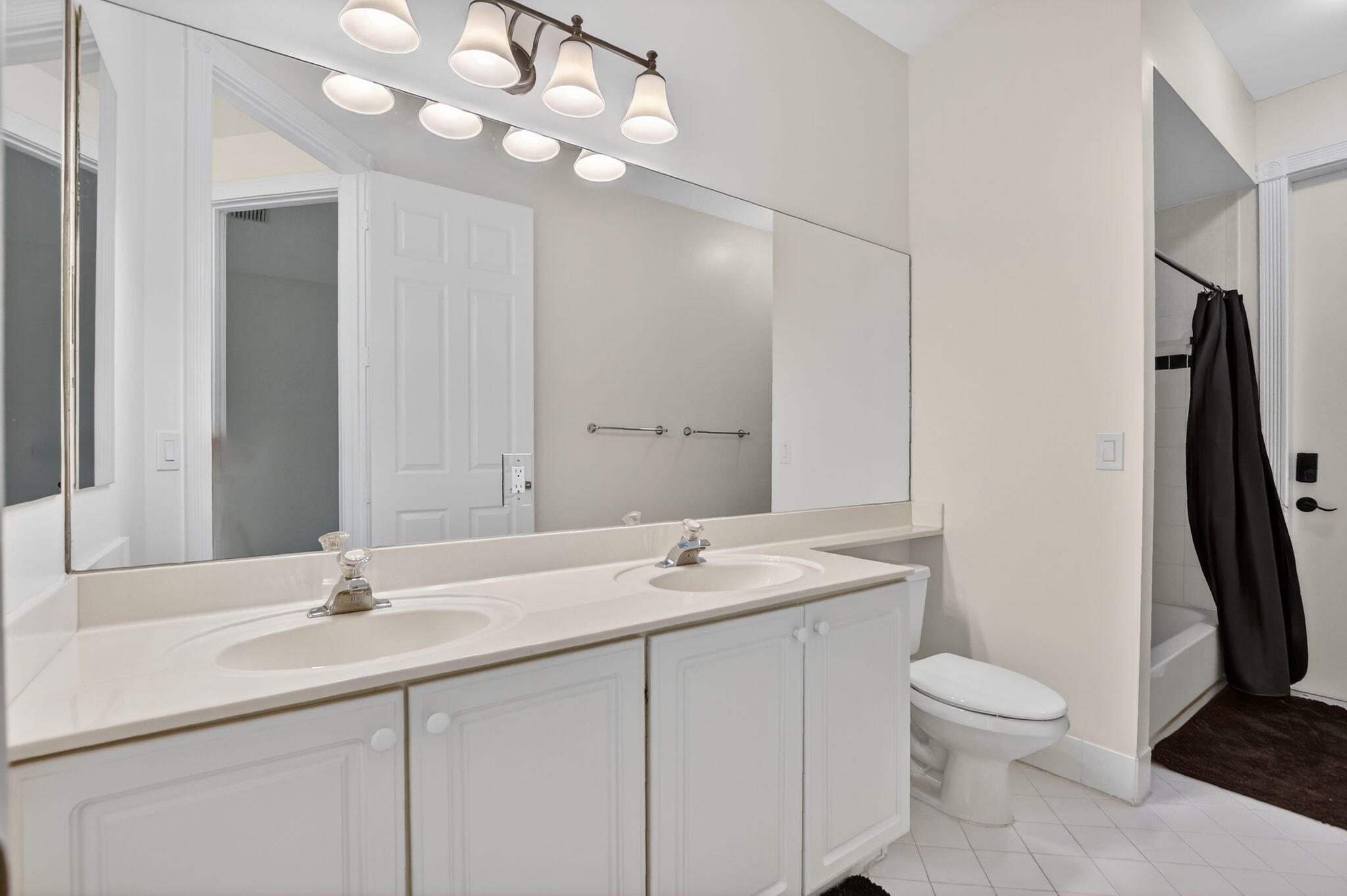 21719 Marigot Drive Boca Raton, FL 33428 - Photo 24 of 53 a bathroom with a granite countertop sink a toilet and a mirror