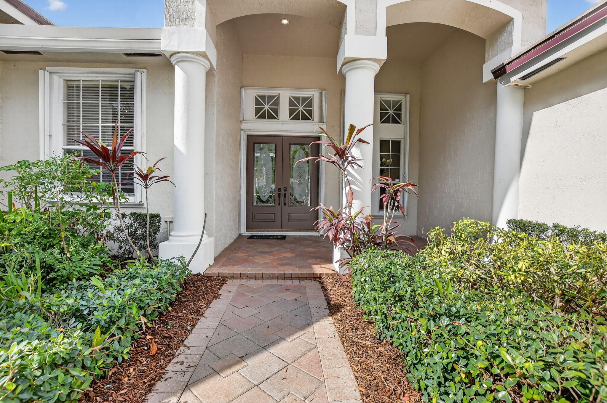 21719 Marigot Drive Boca Raton, FL 33428 - Photo 3 of 53 a front view of a house with a yard