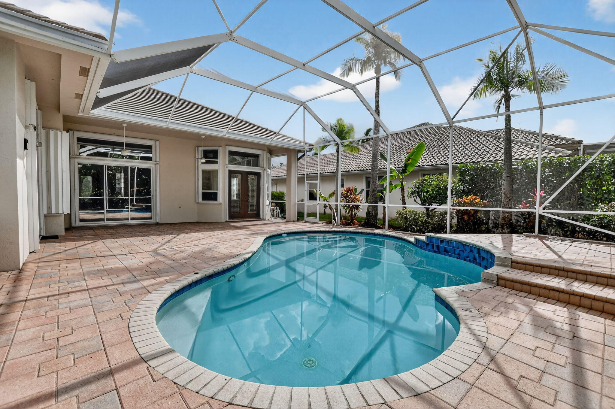 21719 Marigot Drive Boca Raton, FL 33428 - Photo 31 of 53 a view of a swimming pool with a patio