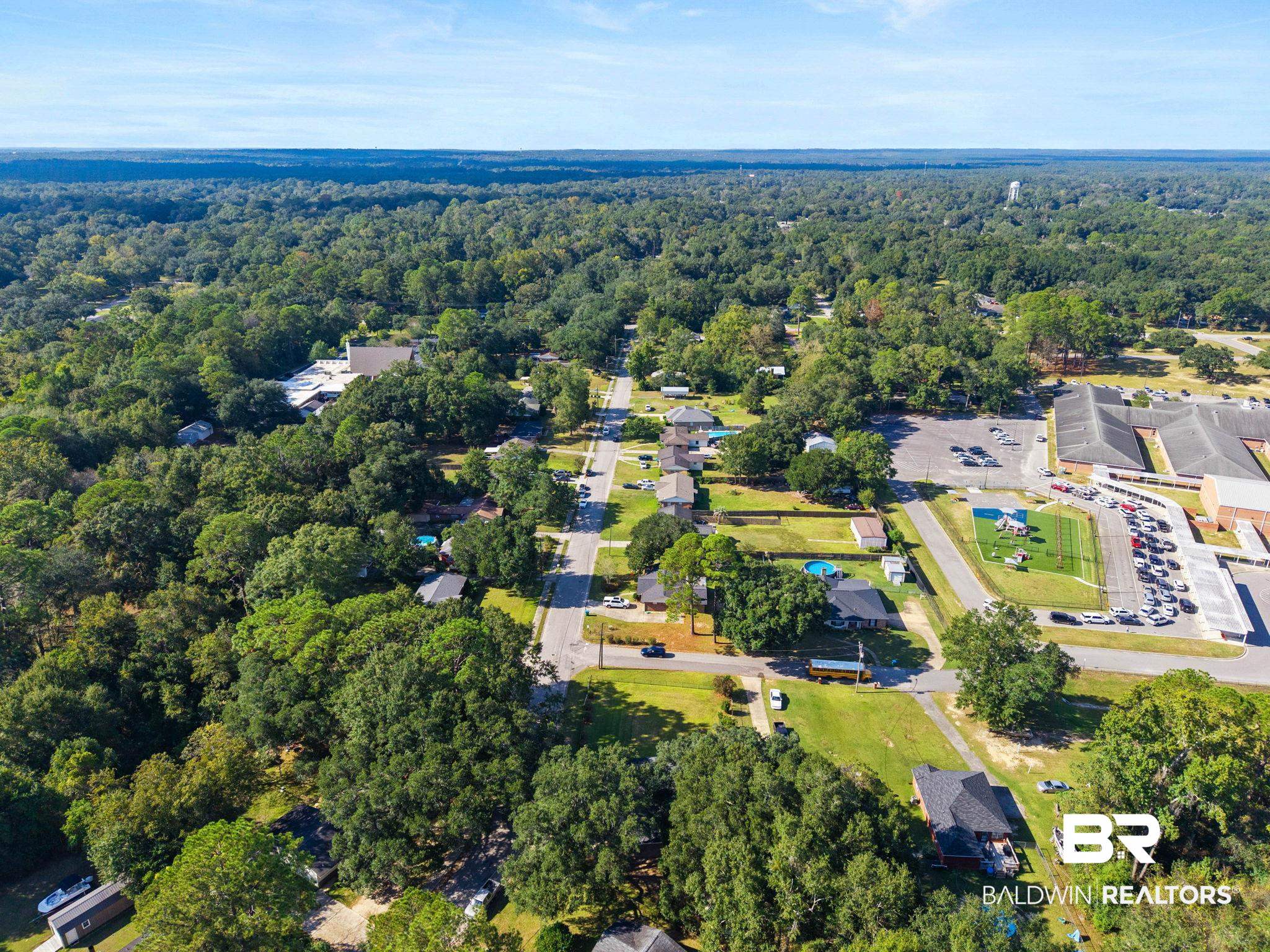 618 Pine Street Saraland, AL 36571 - Photo 40 of 41 Aerial view of property and surrounding area featuring a heavily wooded area and nearby suburban area