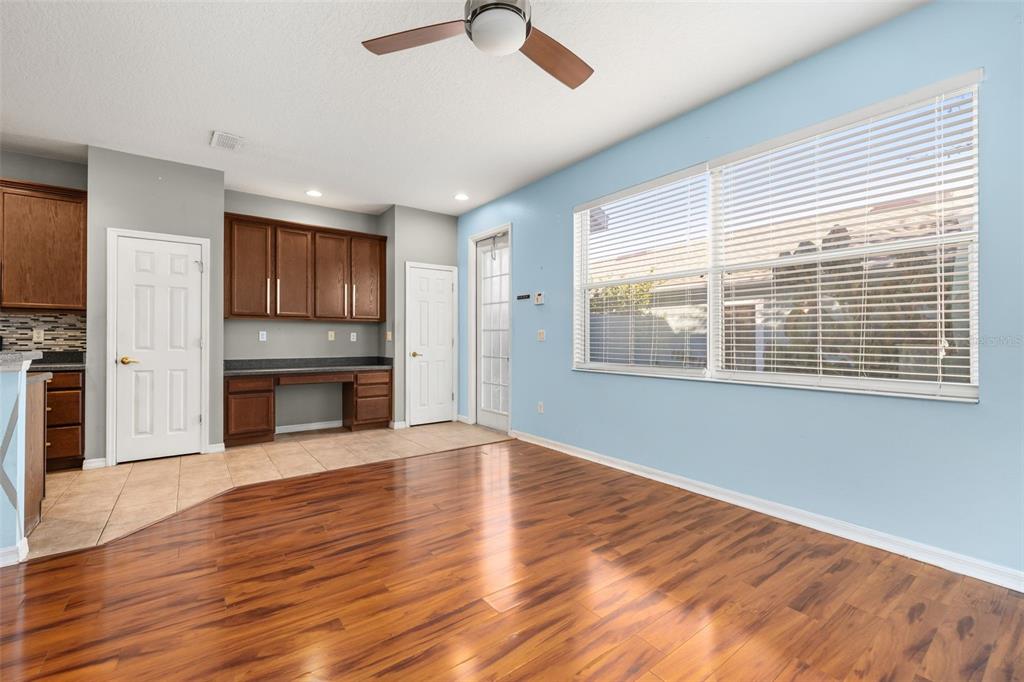 11781 Fitzgerald Butler Road Orlando, FL 32836 - Photo 17 of 37 a view of an empty room with a window and wooden floor