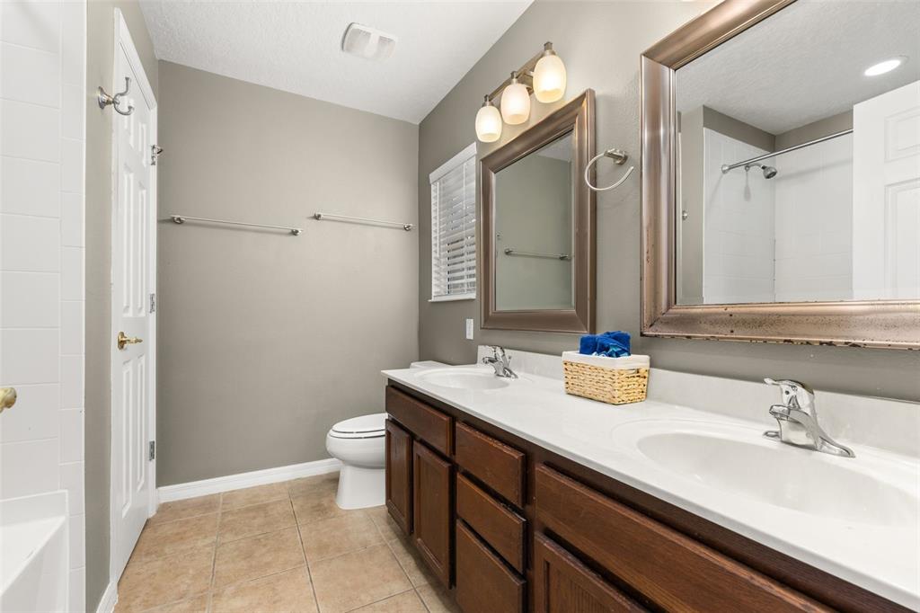 11781 Fitzgerald Butler Road Orlando, FL 32836 - Photo 24 of 37 a bathroom with a sink and a mirror