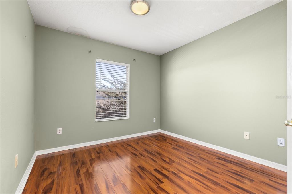 11781 Fitzgerald Butler Road Orlando, FL 32836 - Photo 28 of 37 a view of empty room with wooden floor