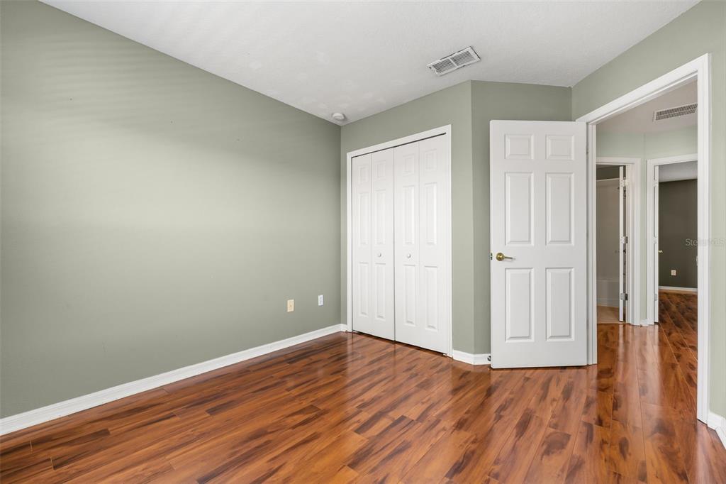 11781 Fitzgerald Butler Road Orlando, FL 32836 - Photo 29 of 37 wooden floor in an empty room