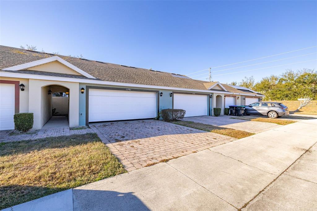 11781 Fitzgerald Butler Road Orlando, FL 32836 - Photo 32 of 37 a front view of a house with a yard