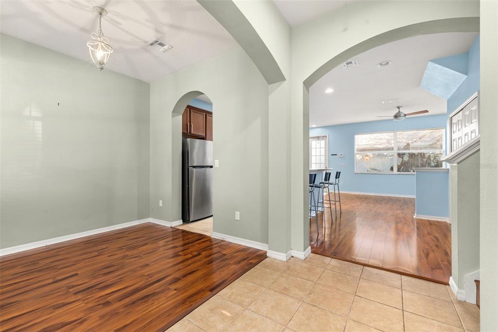 11781 Fitzgerald Butler Road Orlando, FL 32836 - Photo 6 of 37 a view of a room with wooden floor and entryway