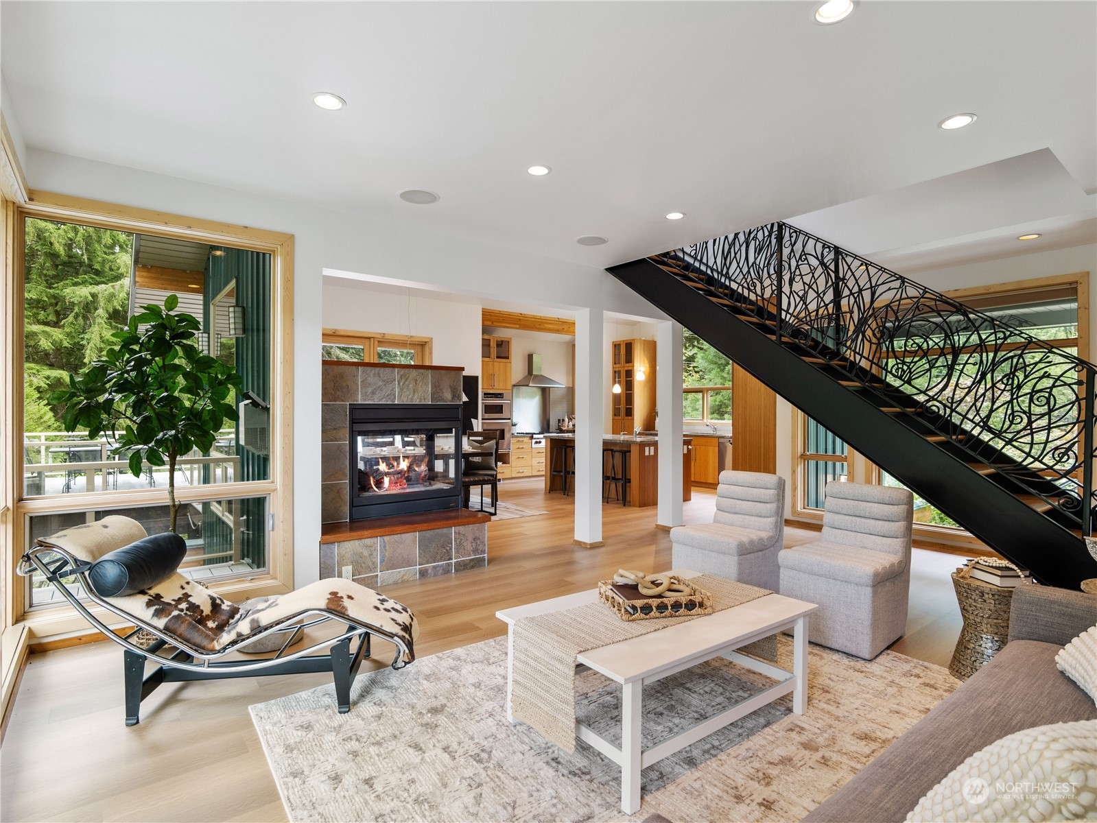 51417 South Riverside Road Gold Bar, WA 98251 - Photo 11 of 40 a living room with furniture and a potted plant