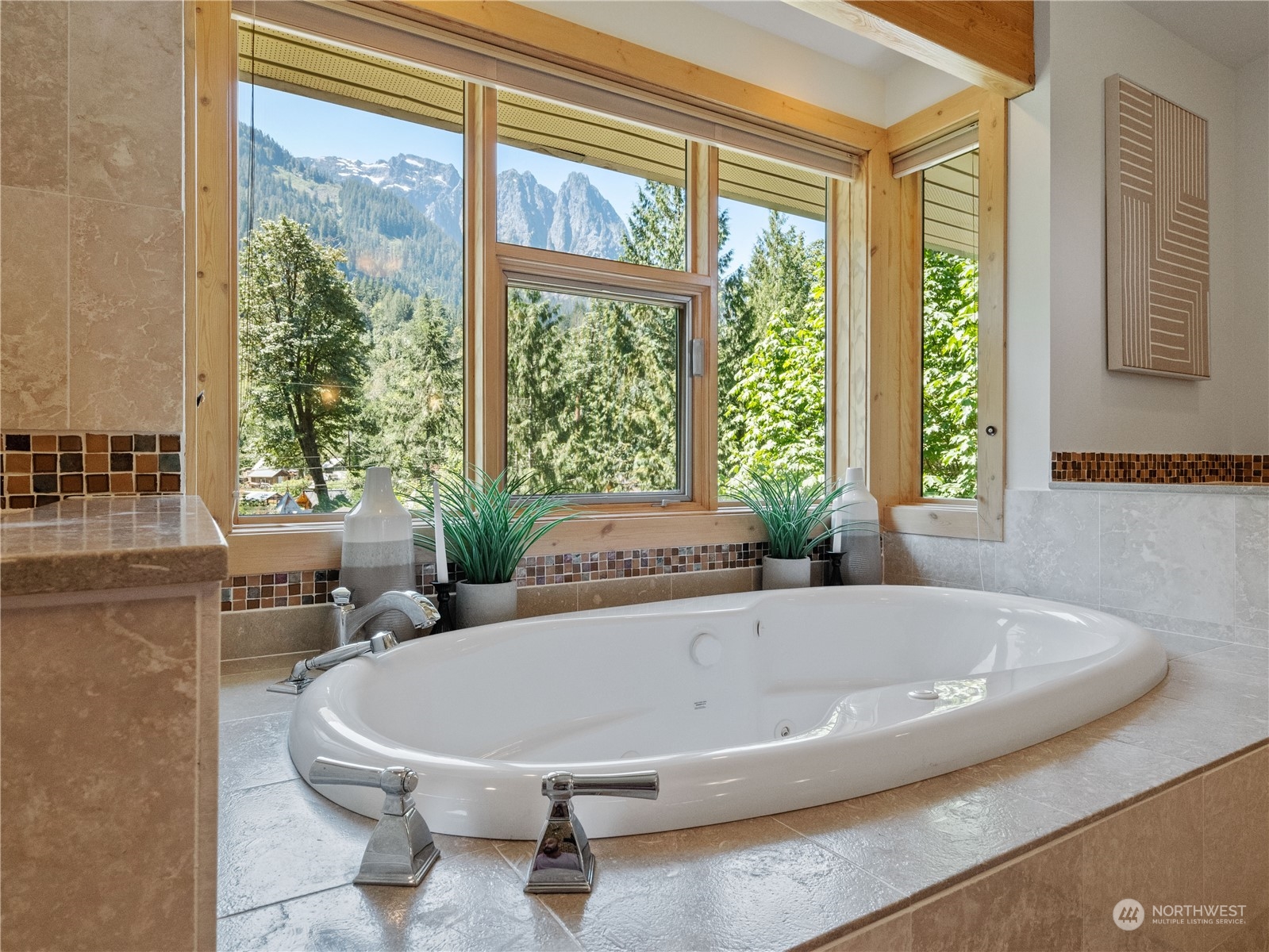 51417 South Riverside Road Gold Bar, WA 98251 - Photo 28 of 40 a bath tub sitting in a bathroom next to a window