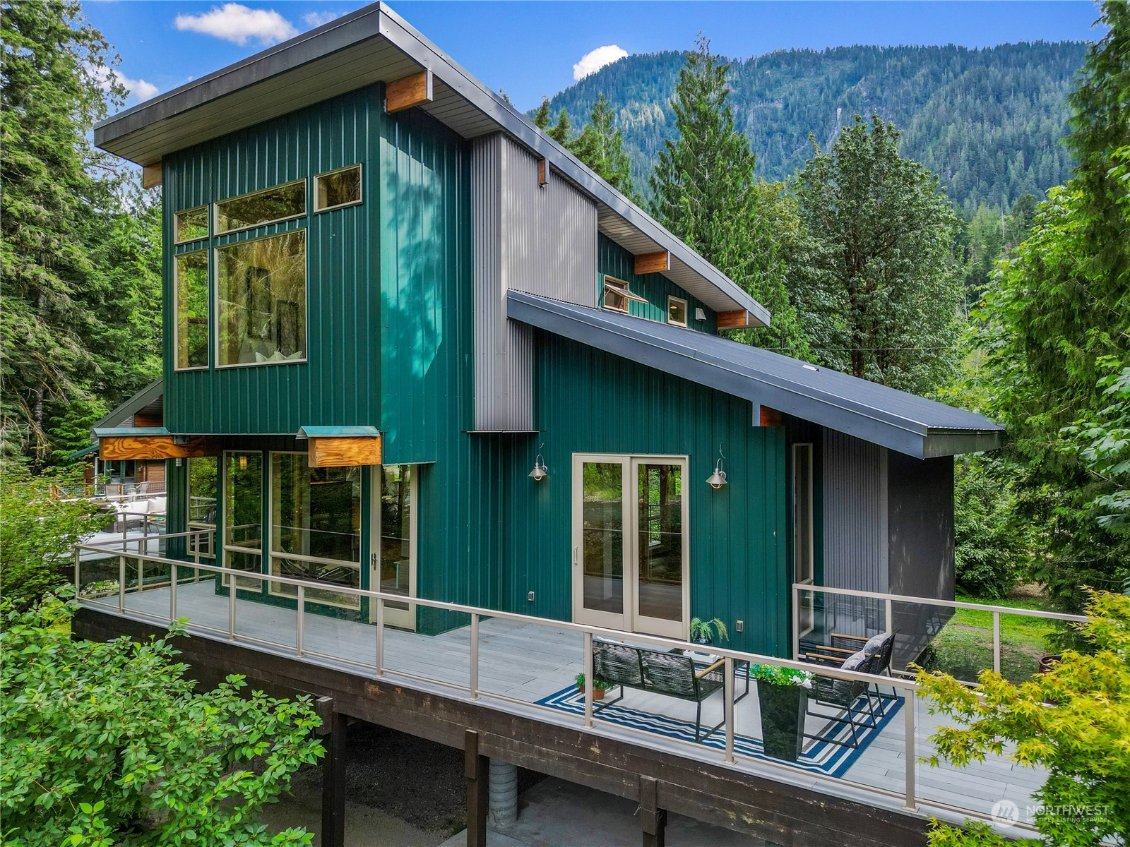 51417 South Riverside Road Gold Bar, WA 98251 - Photo 3 of 40 a backyard of a house with seating space