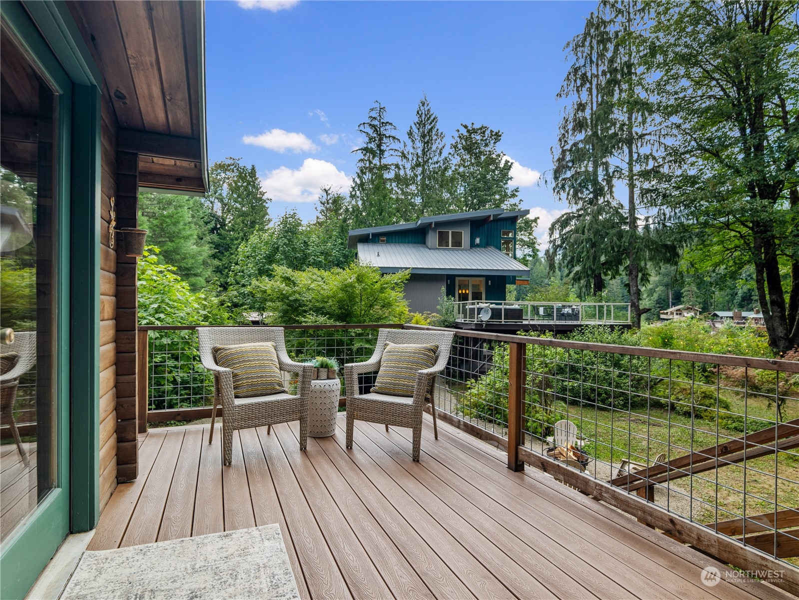 51417 South Riverside Road Gold Bar, WA 98251 - Photo 32 of 40 a view of a chairs and table on the balcony