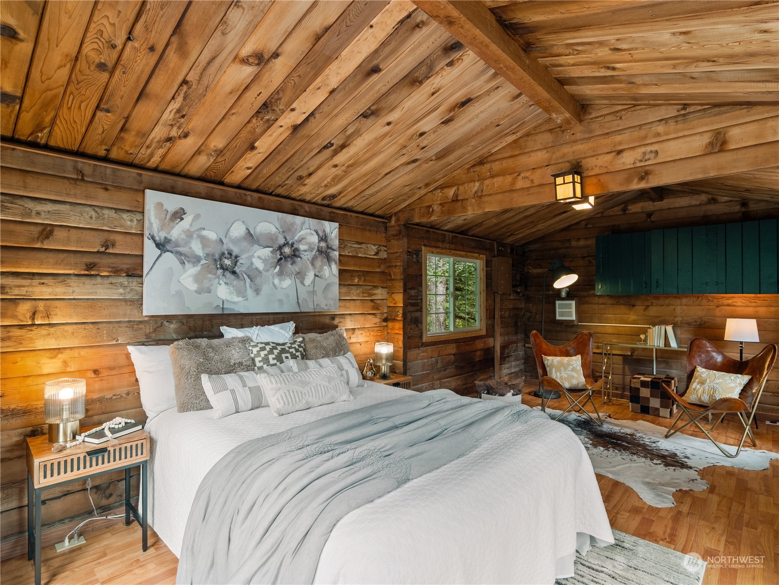 51417 South Riverside Road Gold Bar, WA 98251 - Photo 33 of 40 a bedroom with a bed a table and chair with the potted plants