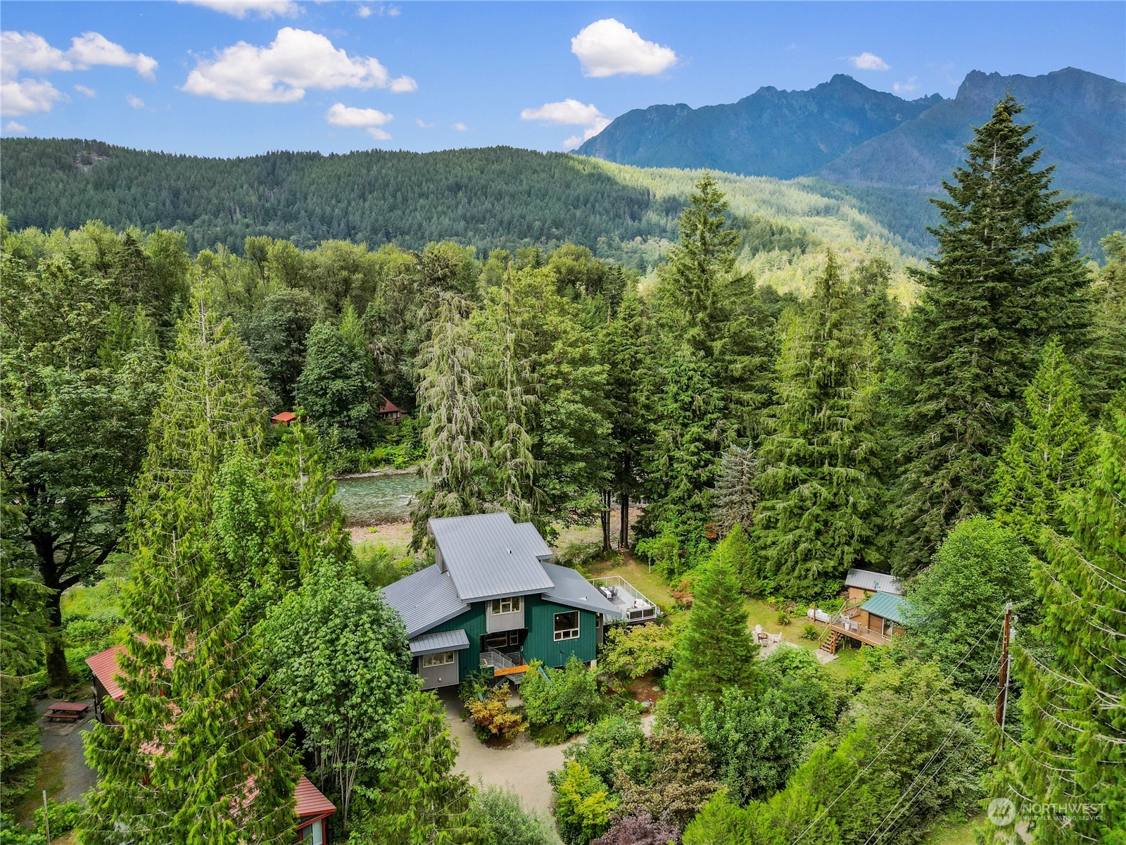 51417 South Riverside Road Gold Bar, WA 98251 - Photo 36 of 40 a view of a garden with an outdoor seating