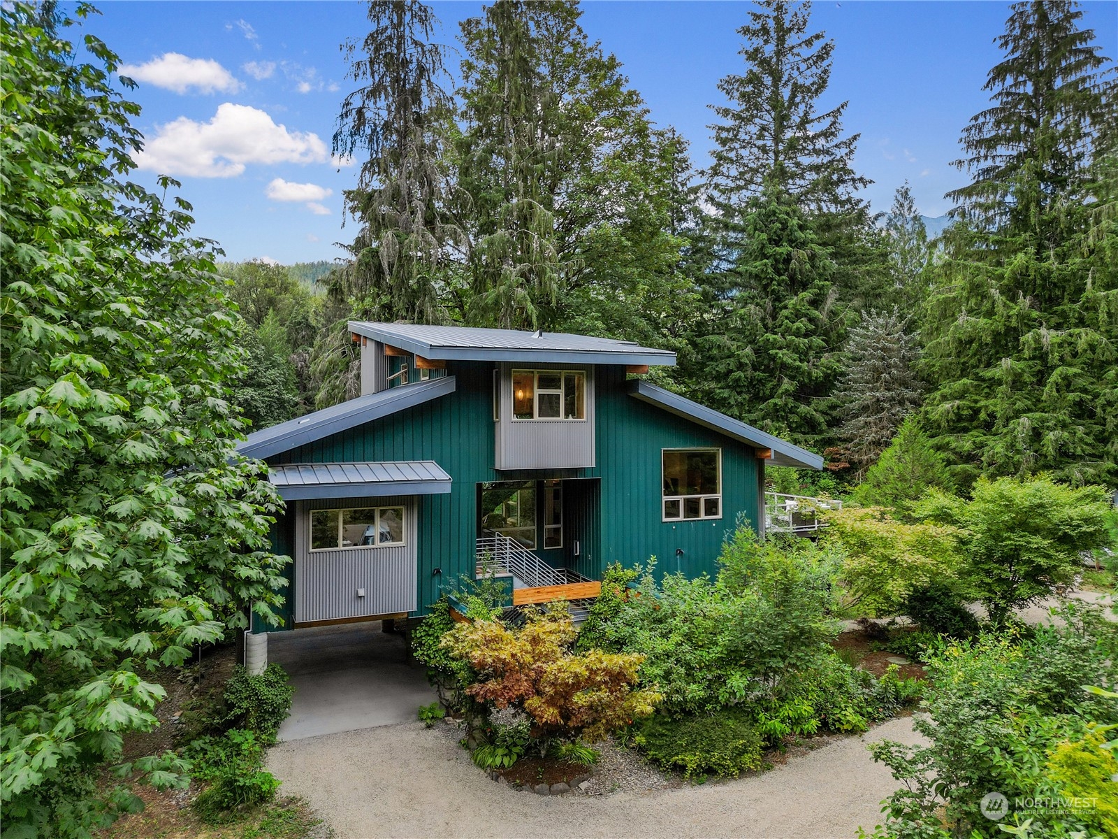51417 South Riverside Road Gold Bar, WA 98251 - Photo 5 of 40 a front view of a house with garden