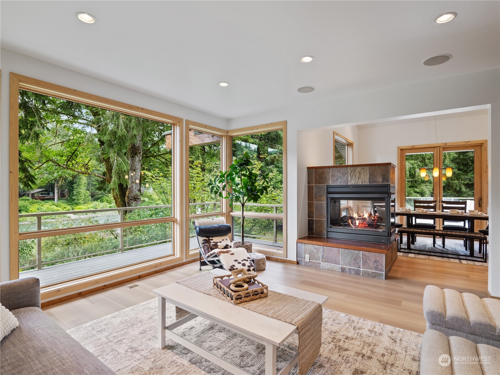 51417 South Riverside Road Gold Bar, WA 98251 - Photo 10 of 40 a living room with furniture and a fireplace