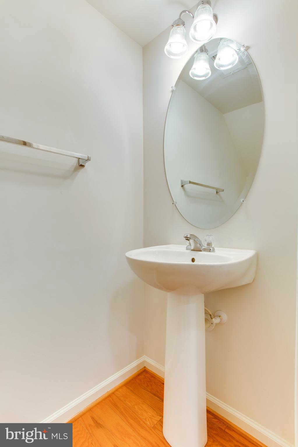 6020 Machen Road, Unit 177 Centreville, VA 20121 - Photo 15 of 30 a bathroom with a sink and a mirror