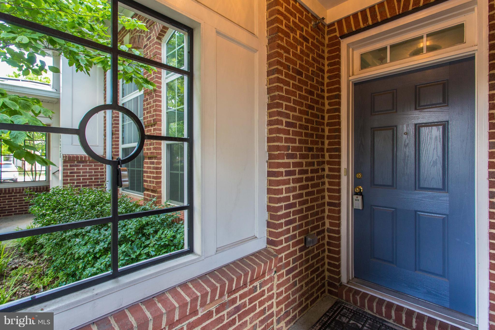 6020 Machen Road, Unit 177 Centreville, VA 20121 - Photo 3 of 30 a view of a brick house with a large window