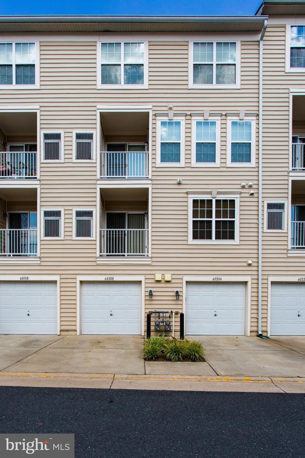 6020 Machen Road, Unit 177 Centreville, VA 20121 - Photo 30 of 30 a front view of residential houses with garage