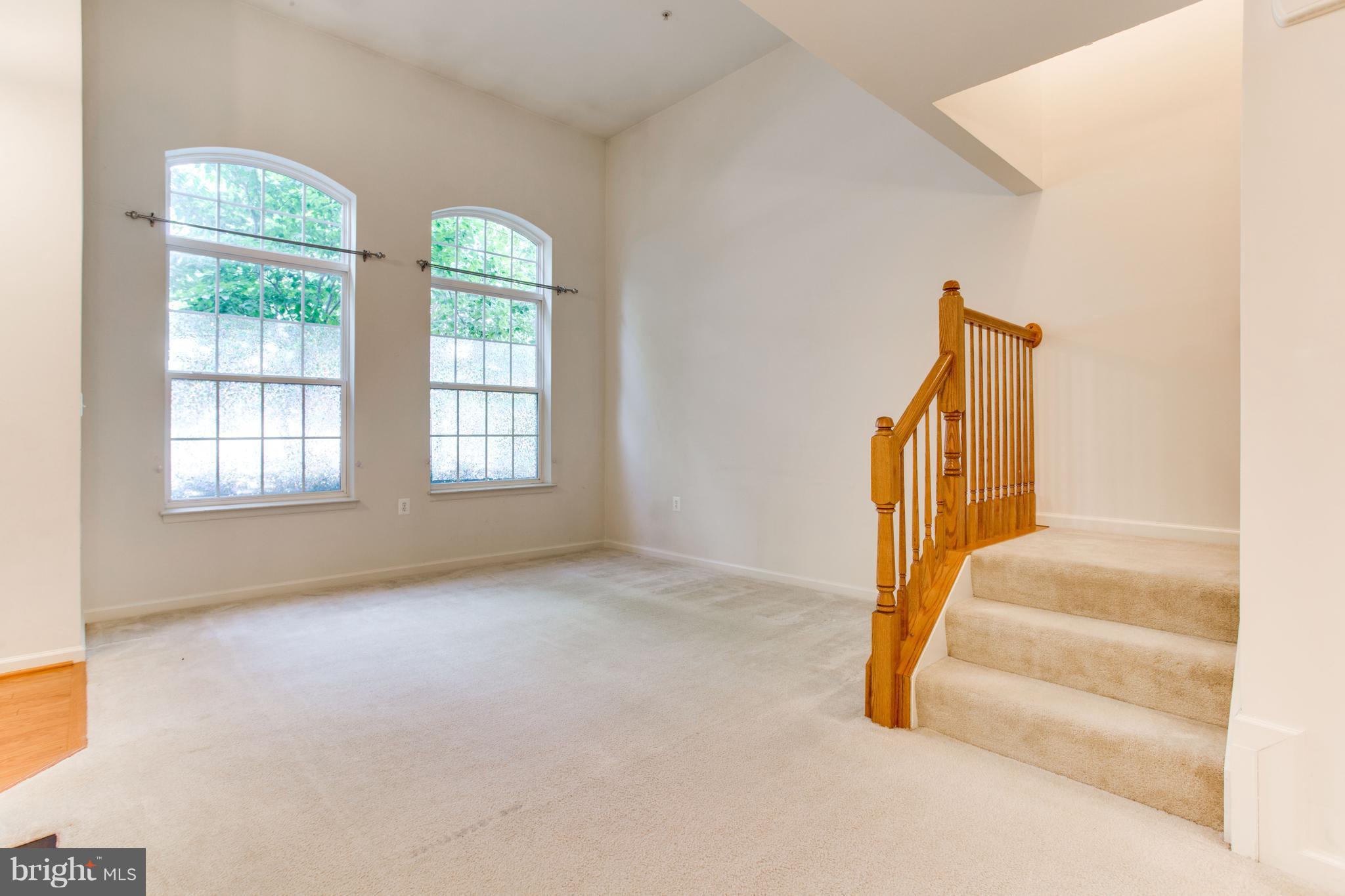 6020 Machen Road, Unit 177 Centreville, VA 20121 - Photo 6 of 30 an entryway with floor to ceiling windows and entryway