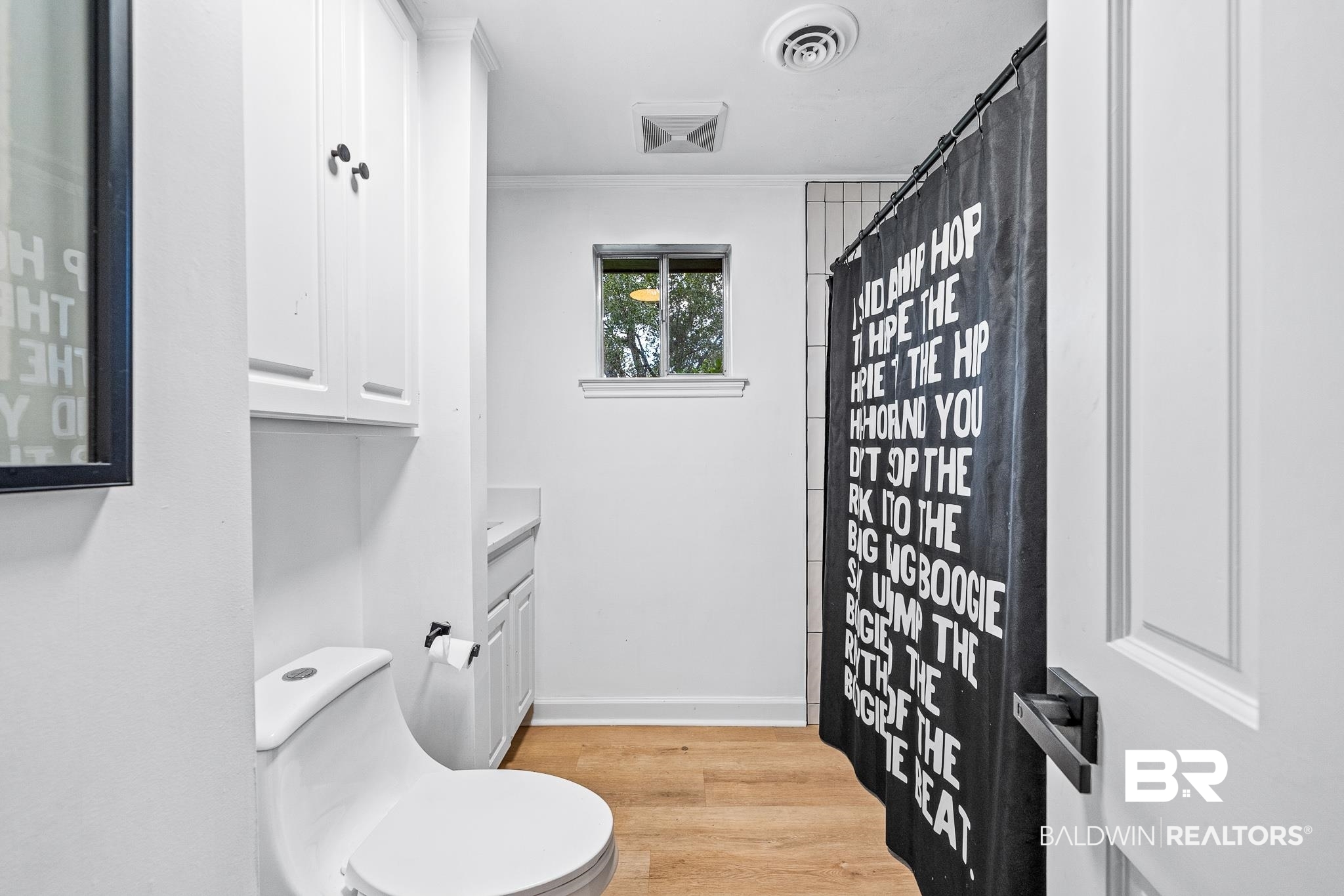18513 Yacht Club Road Foley, AL 36535 - Photo 20 of 53 Bathroom featuring vanity, wood-type flooring, and toilet