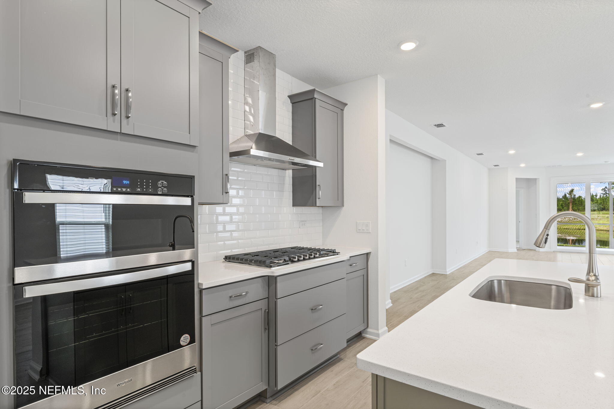 81 Ripple Road St. Augustine, FL 32095 - Photo 13 of 94 a kitchen with granite countertop a sink stainless steel appliances and cabinets