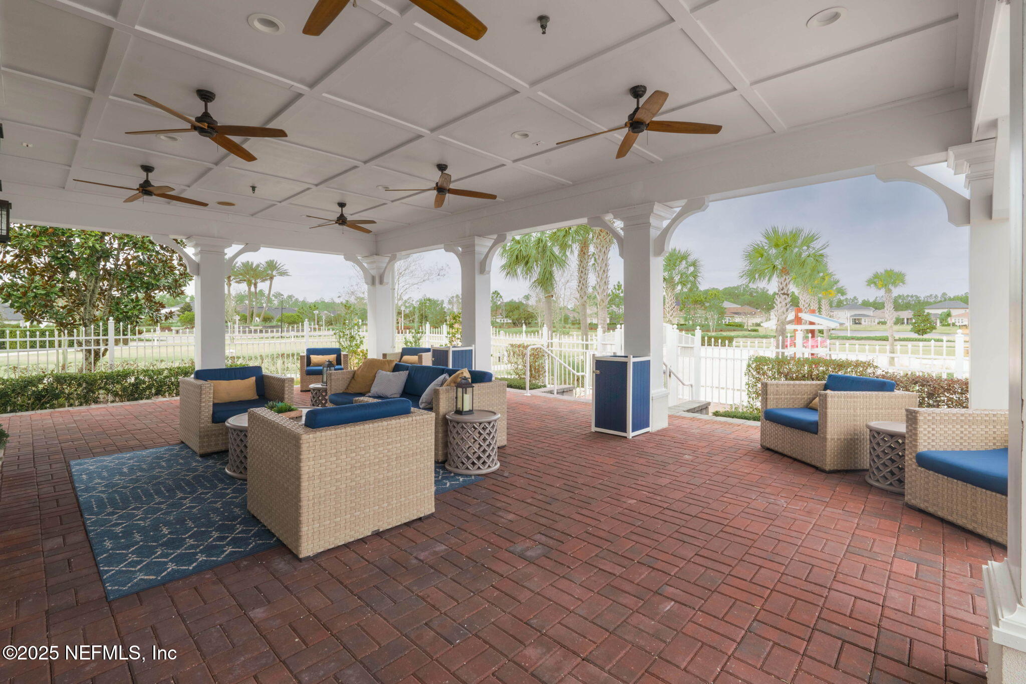 81 Ripple Road St. Augustine, FL 32095 - Photo 58 of 94 a living room with patio furniture and a floor to ceiling window