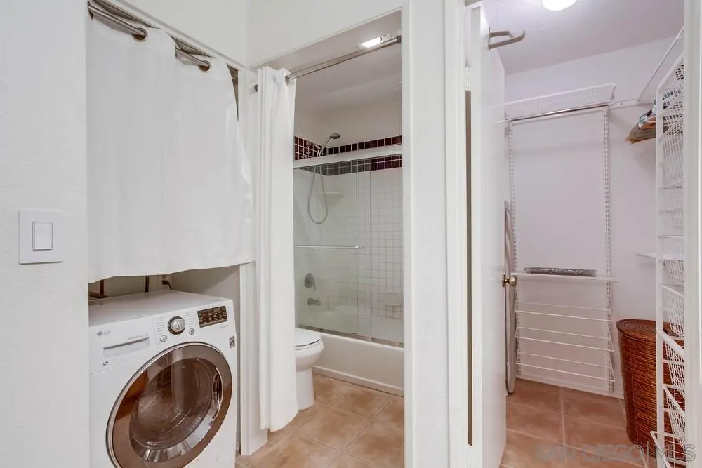 6767 Friars Road, Unit 150 San Diego, CA 92108 - Photo 11 of 20 a bathroom with a shower and a toilet