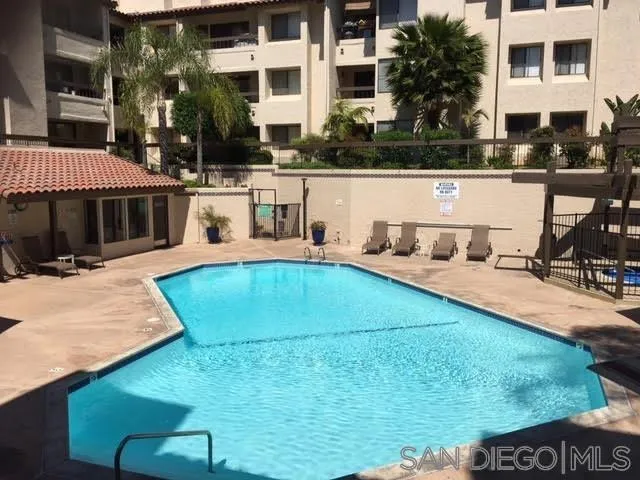 6767 Friars Road, Unit 150 San Diego, CA 92108 - Photo 17 of 20 a swimming pool with outdoor seating and yard