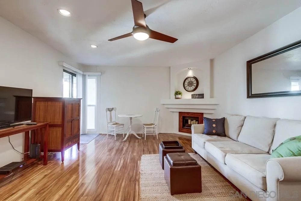 6767 Friars Road, Unit 150 San Diego, CA 92108 - Photo 2 of 20 a living room with furniture and a fireplace