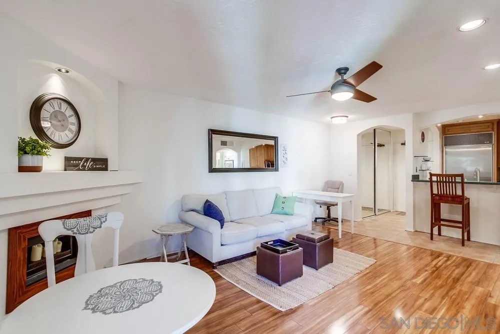 6767 Friars Road, Unit 150 San Diego, CA 92108 - Photo 3 of 20 a living room with furniture a rug and a clock