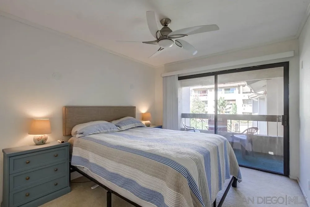 6767 Friars Road, Unit 150 San Diego, CA 92108 - Photo 8 of 20 a bedroom with a bed and a window